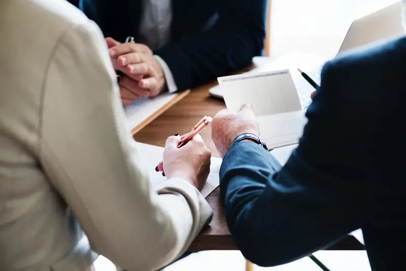 New business owners signing formation and incorporation documents