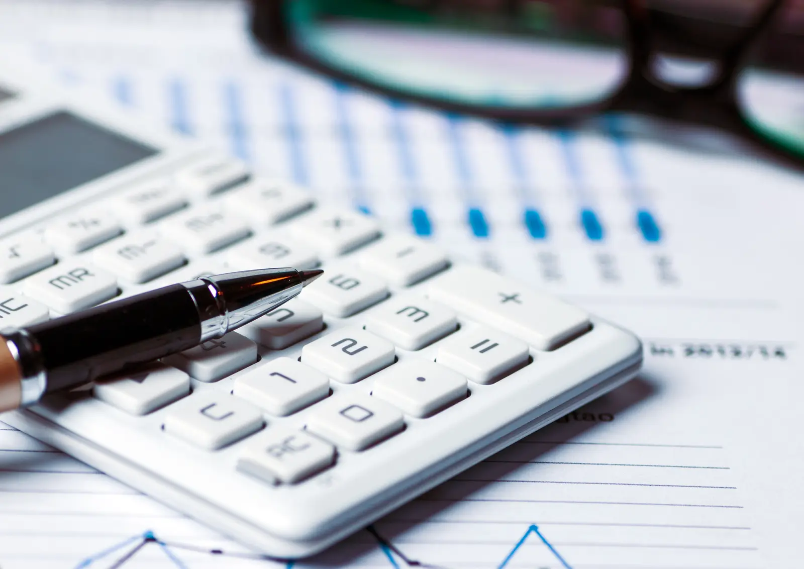 Payroll specialist processing small business payroll checks and tax filings
